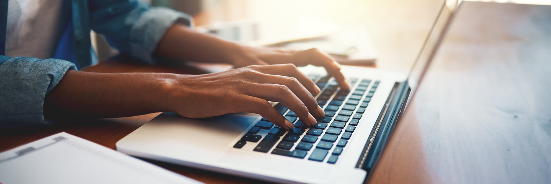 person typing on a laptop