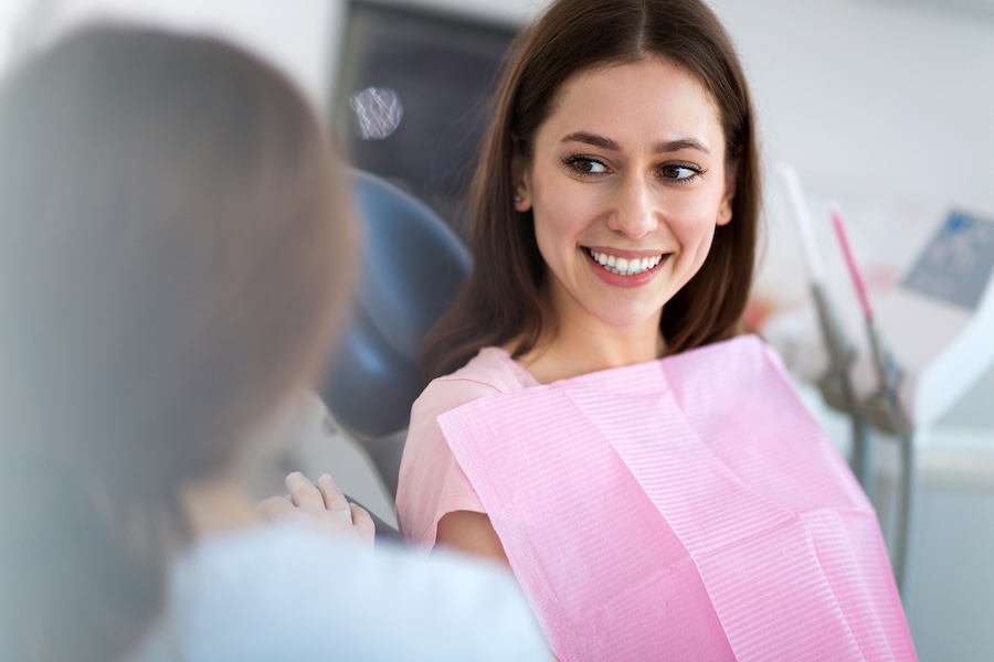 woman in dental chair, why see a prosthodontist