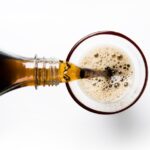 pouring a can of soda, drink carefully to prevent enamel wear and erosion from the acid