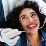 woman replacing aging dental work at the dentist, restorative dentistry